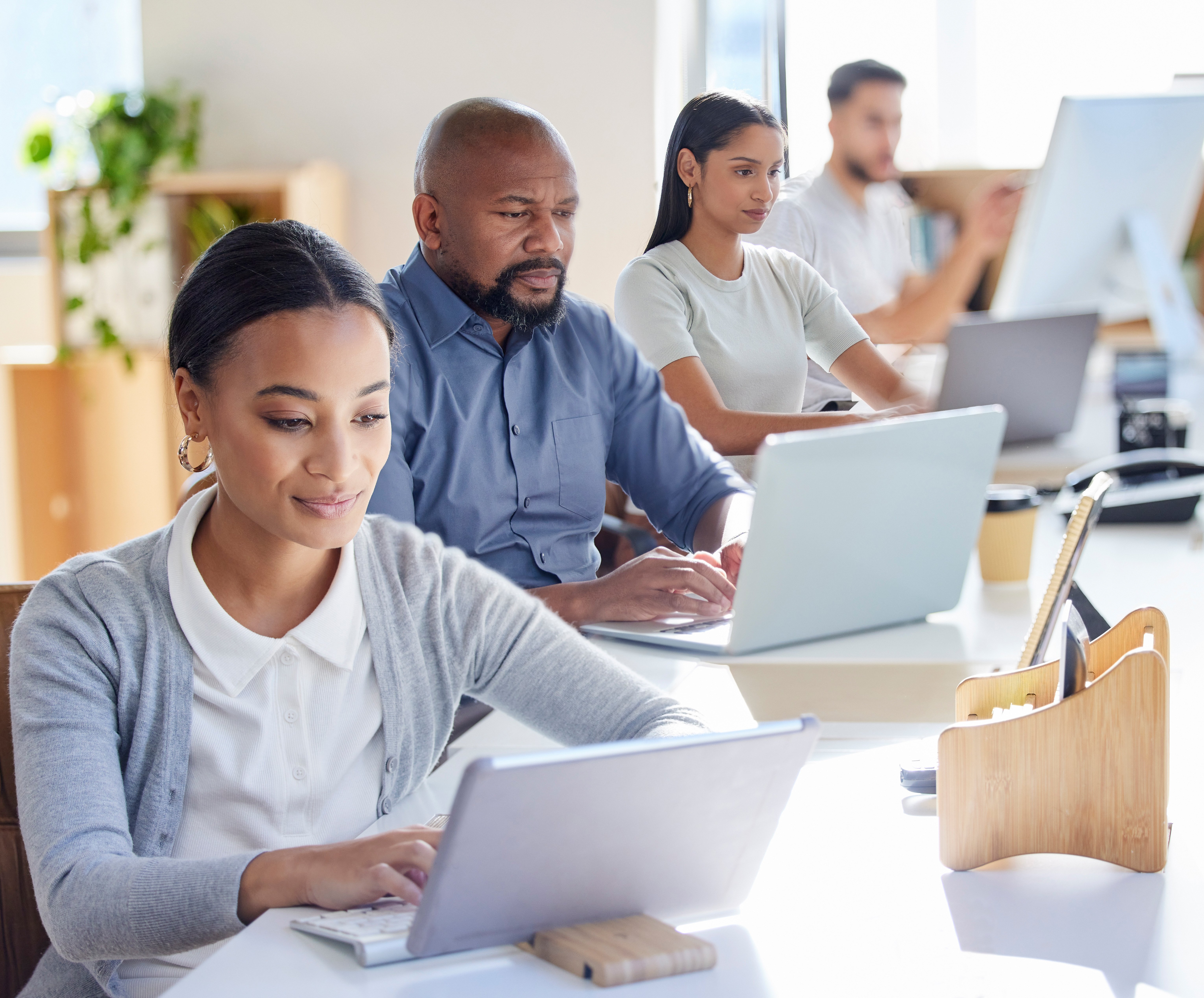 shot-of-a-group-of-businesspeople-working-on-lapto-2025-04-06-02-57-54-utc